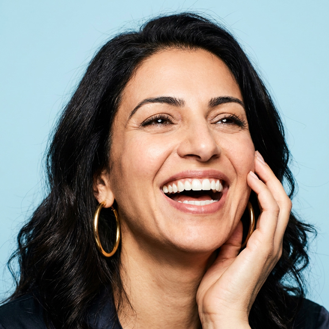 Smiling Farah Family Dental patient