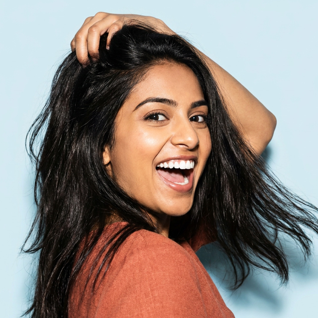 Smiling Farah Family Dental patient